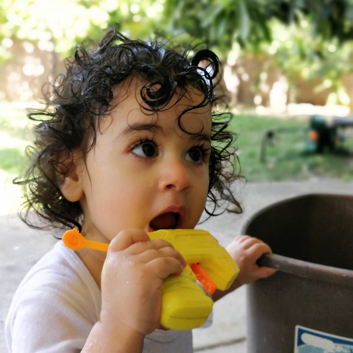 Talia playing with water