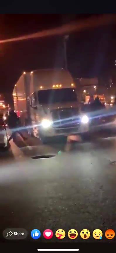 Armed protesters try to rob a FedEx truck. The...