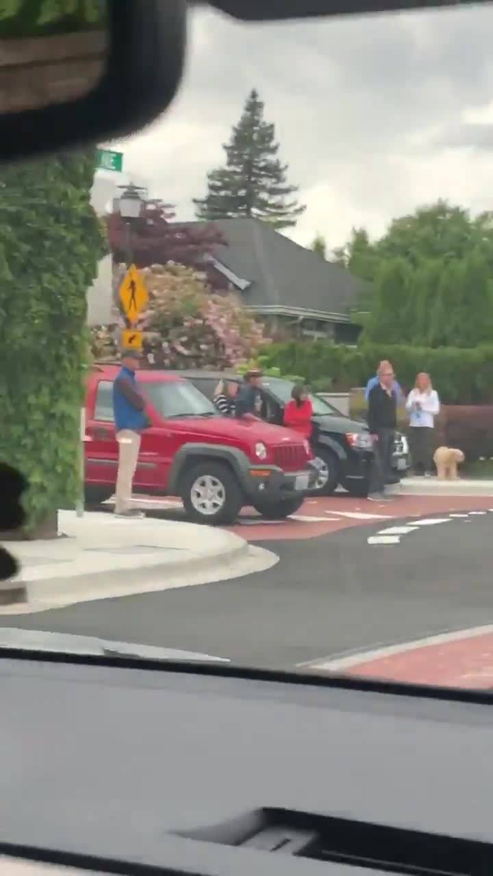 Armed residents in Seattle suburb blocking road and standing...