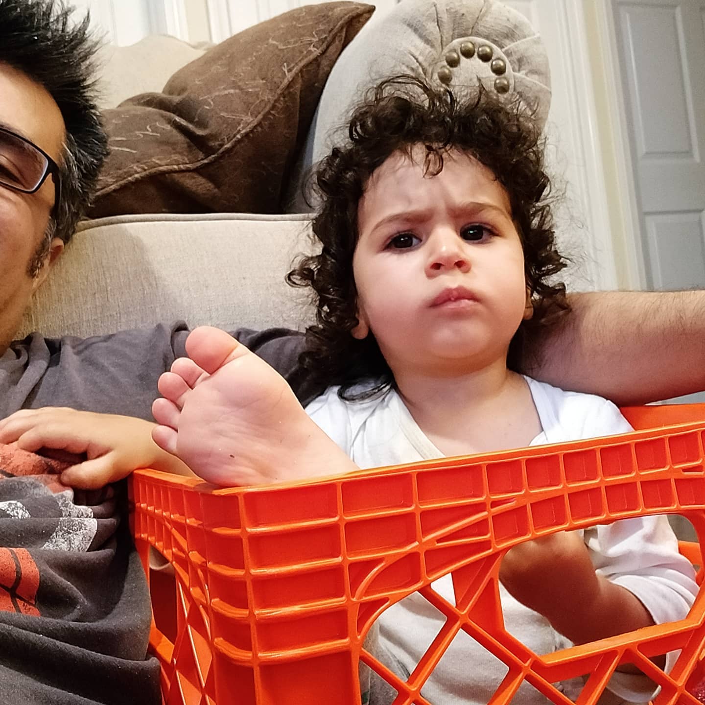 Talia sitting in a crate