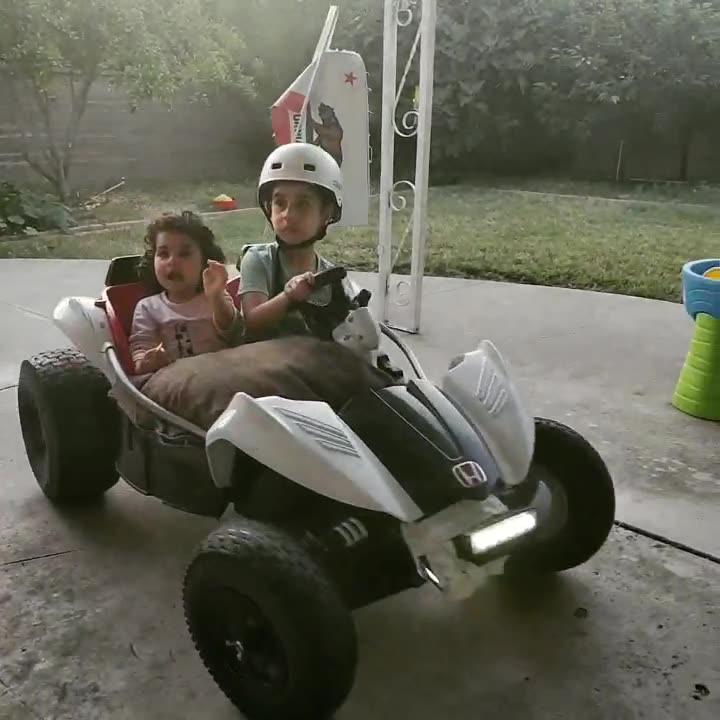 Eren and Talia riding the dune racer