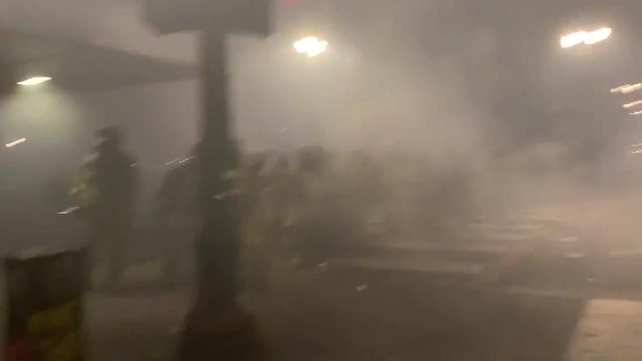 Tear gas is deployed. Little visibility with smoke everywhere