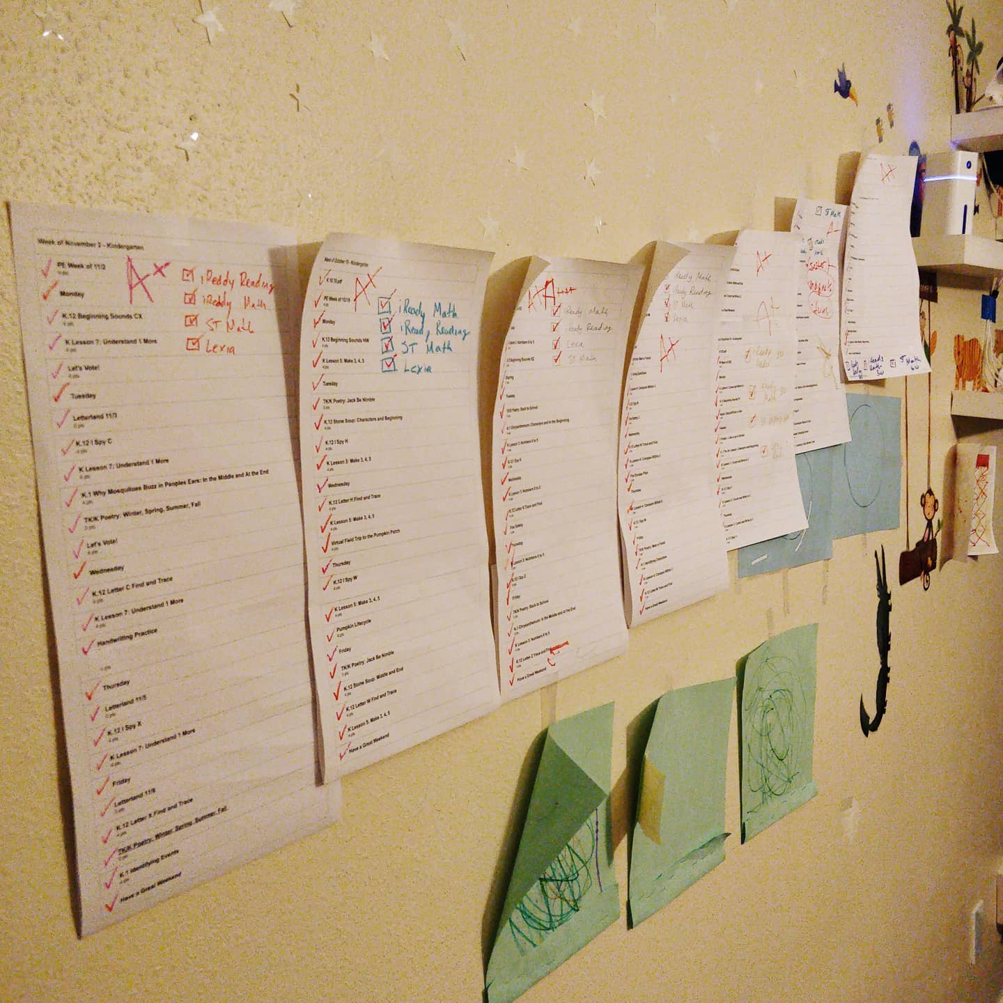 Eren's wall of completed schoolwork