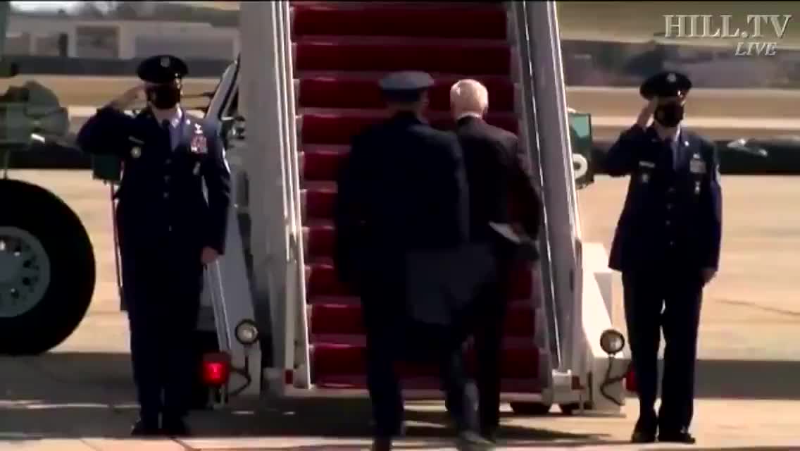 Biden trying to climb the stairs to Air Force...