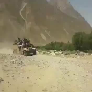 Taliban and ANA soldiers together on a Humvee in...