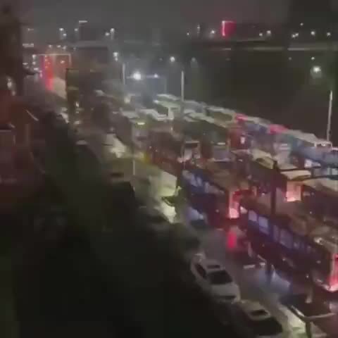 China sending in hundreds of buses to transport thousands...
