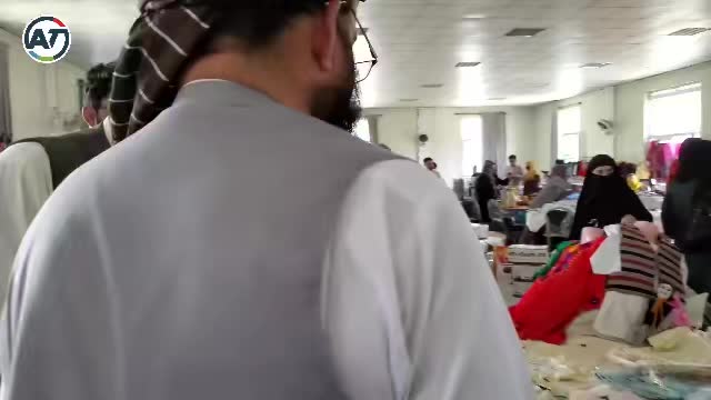 Mobeen Khan attends a women's handicraft expo in Kabul...