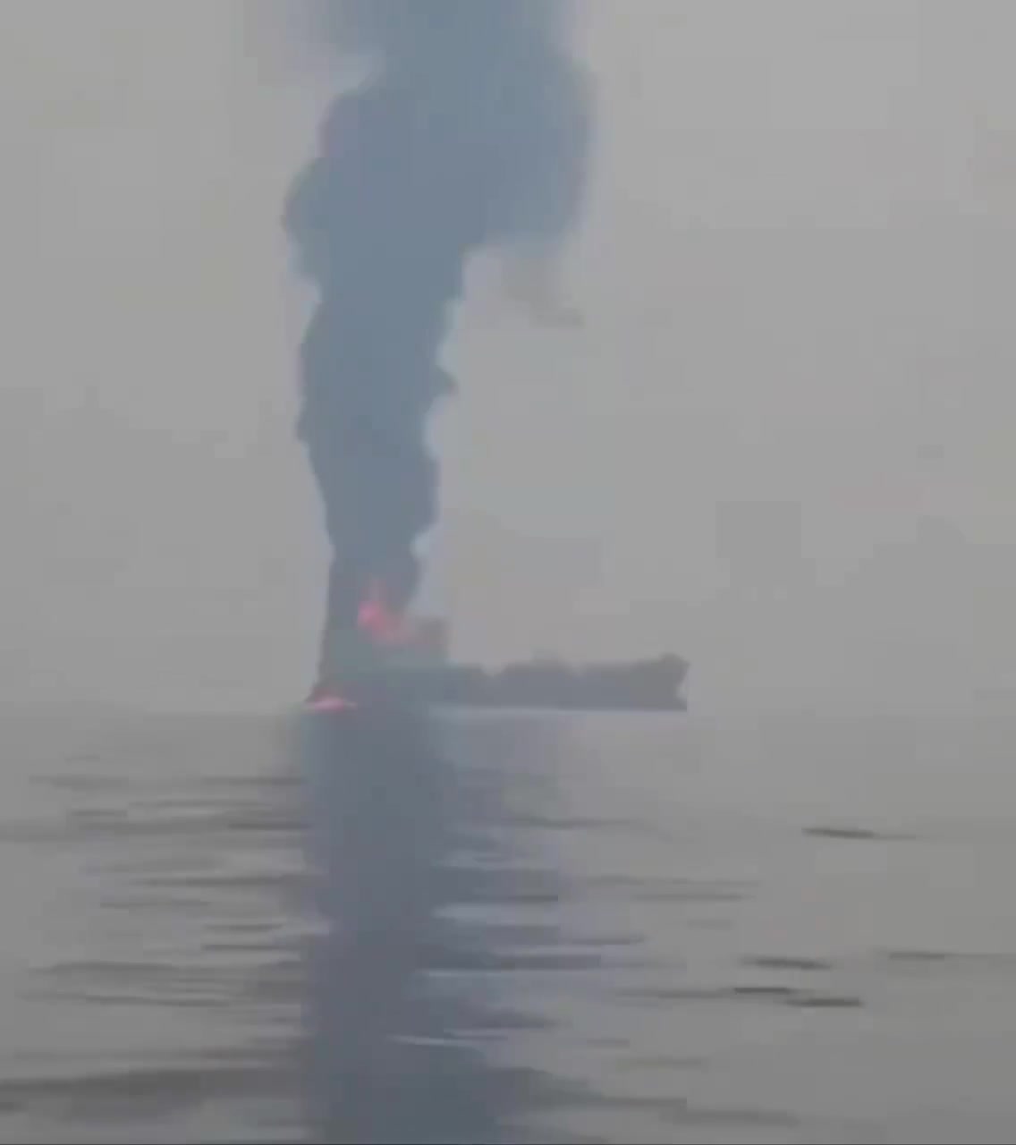 An oil tanker on fire off the coast of...